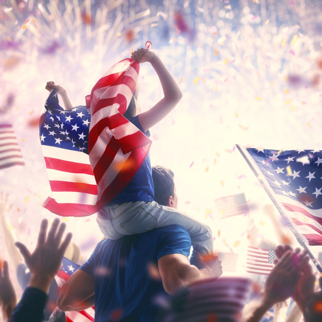 Happy Americans waving flags and celebrating the 4th of July