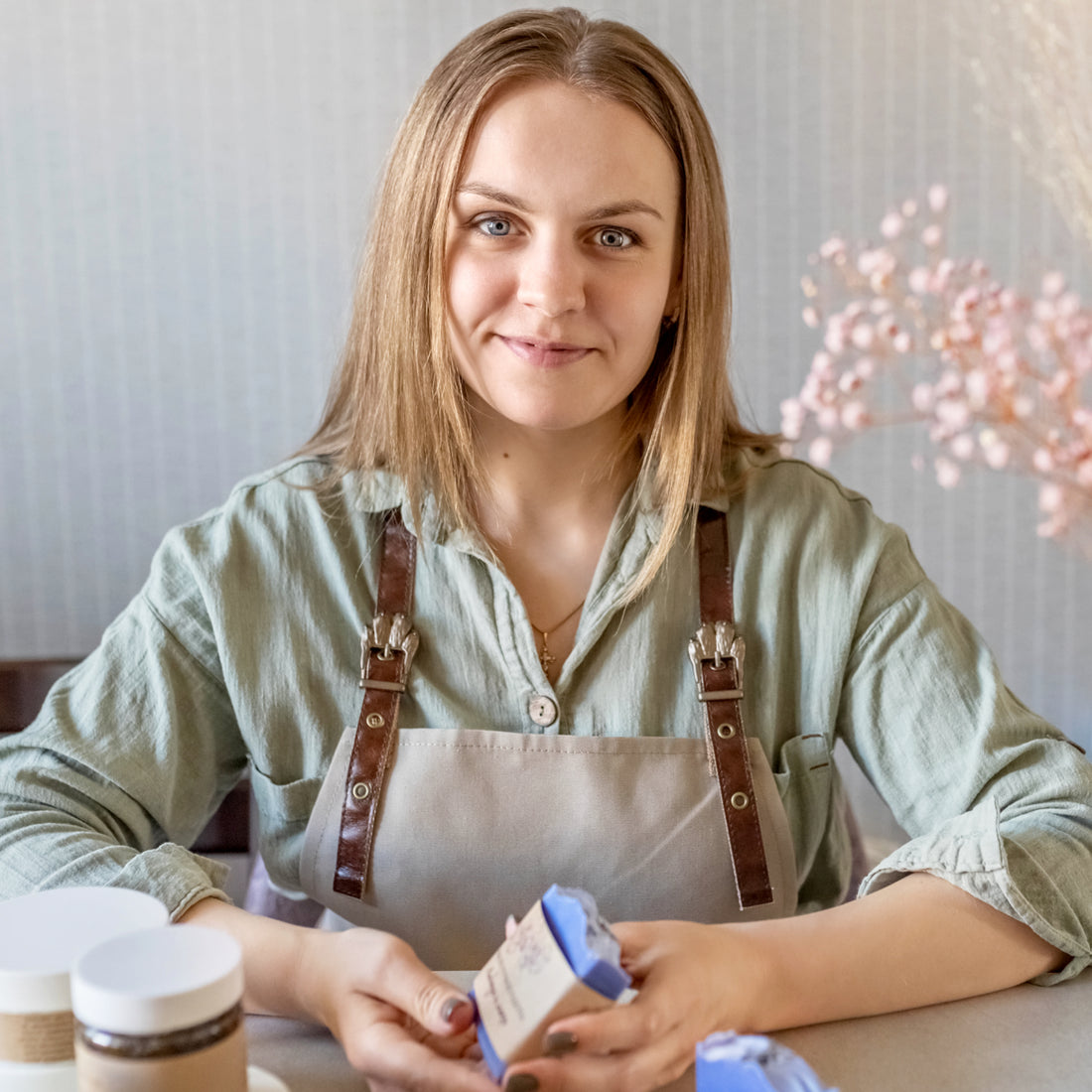 Artisan woman finishing up a bar of handmade soap