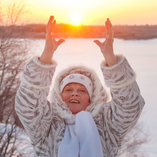 Woman enjoying the setting sun on winter solstice 